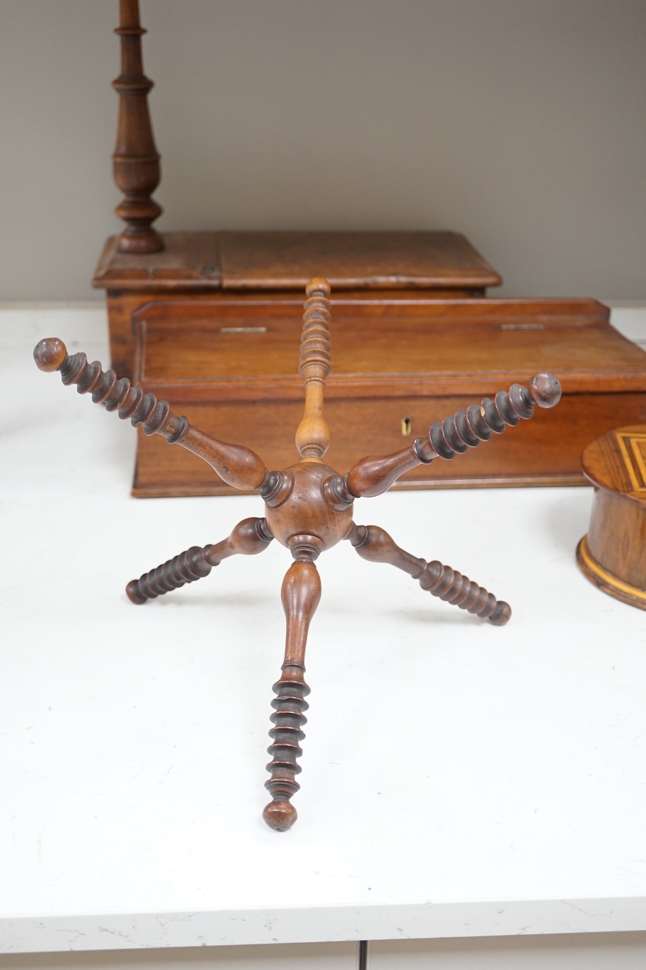 19th/early 20th century woodenware to include Pitcairn Islands circular box and treen ‘cat’ or plate stand, largest 44cm wide. Condition - fair to good